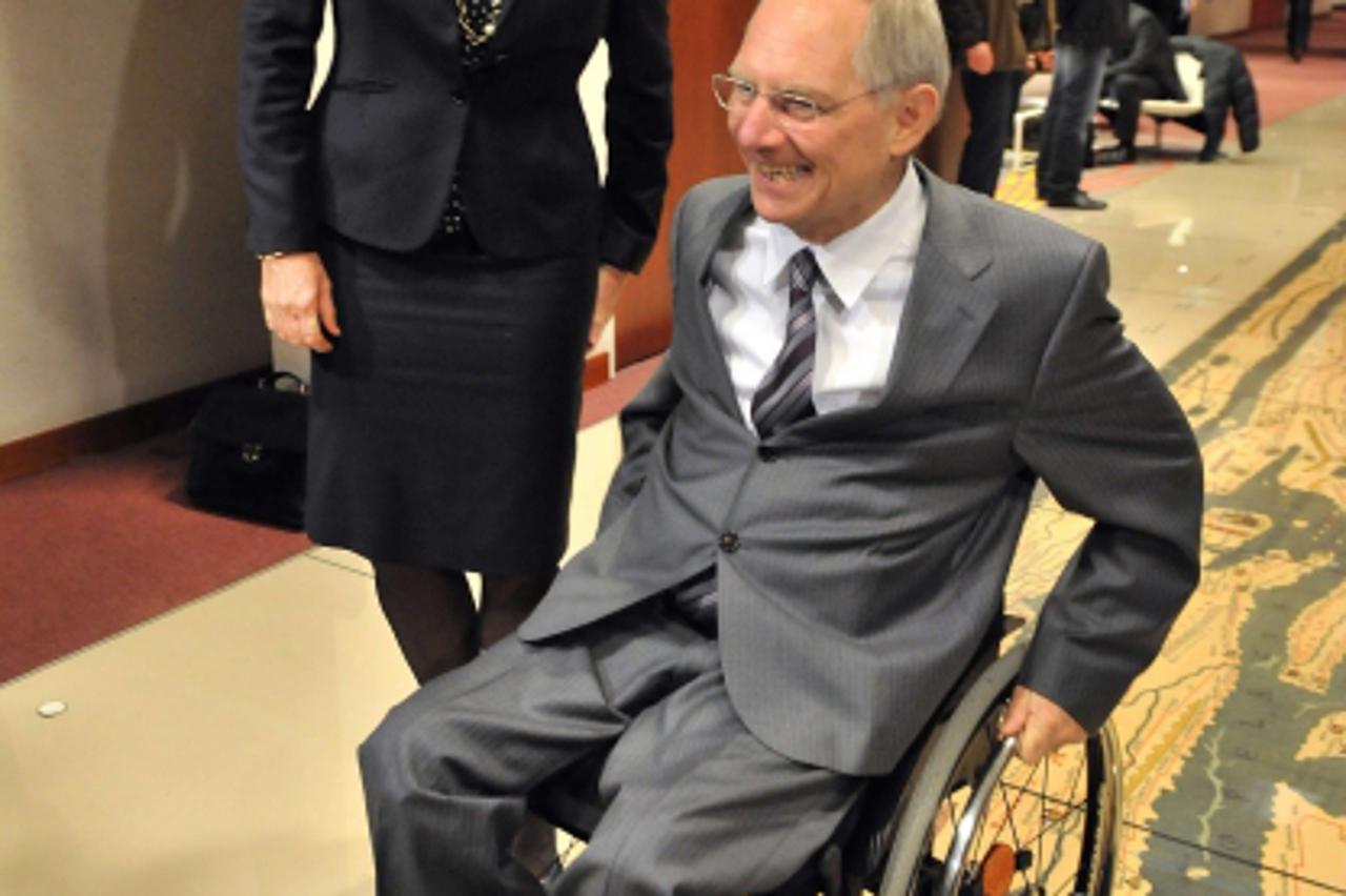 'French Finance Minister Christine Lagarde (L) and German Finance Minister Wolfgang Schaeuble (R) talk prior to an Eurogroup council meeting on March 15, 2010 at the EU headquarters in Brussels. AFP P