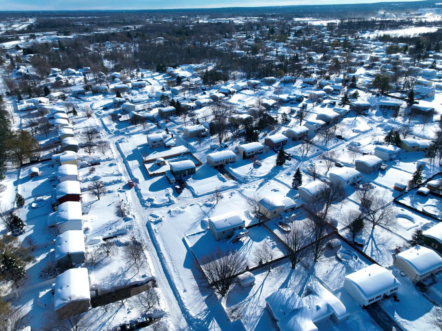 A residential neighborhood is covered in snow after a recent storm in Buffalo, New York, U.S. November 21, 2022.  REUTERS/Drone Base Photo: DRONE BASE/REUTERS