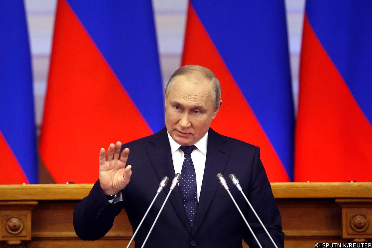 Russian President Vladimir Putin delivers a speech during a meeting of the Council of Legislators at the Federal Assembly in Saint Petersburg