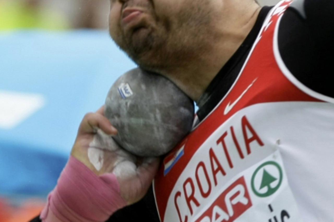 'Nedzad Mulabegovic of Croatia competes in the men\'s shot put qualifications at the European Athletics Championships in Barcelona July 30, 2010.                      REUTERS/Dominic Ebenbichler (SPAI