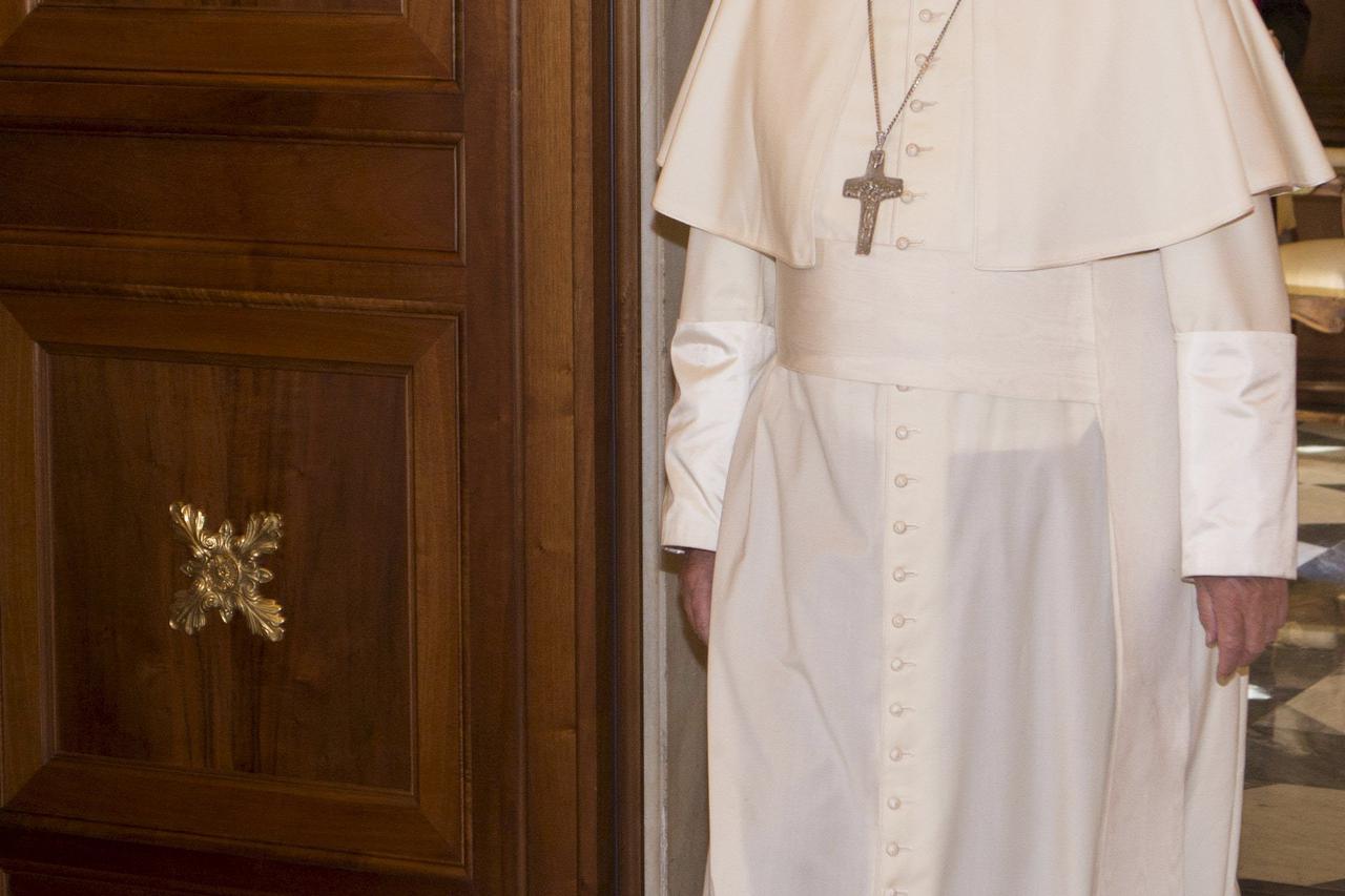 Pope Francis arrives to welcome the Grand Master of the Sovereign Order of Malta, Fra' Matthew Festing, during a private audience in the Pontiff's private library at the Vatican June 25, 2015. REUTERS/Riccardo De Luca