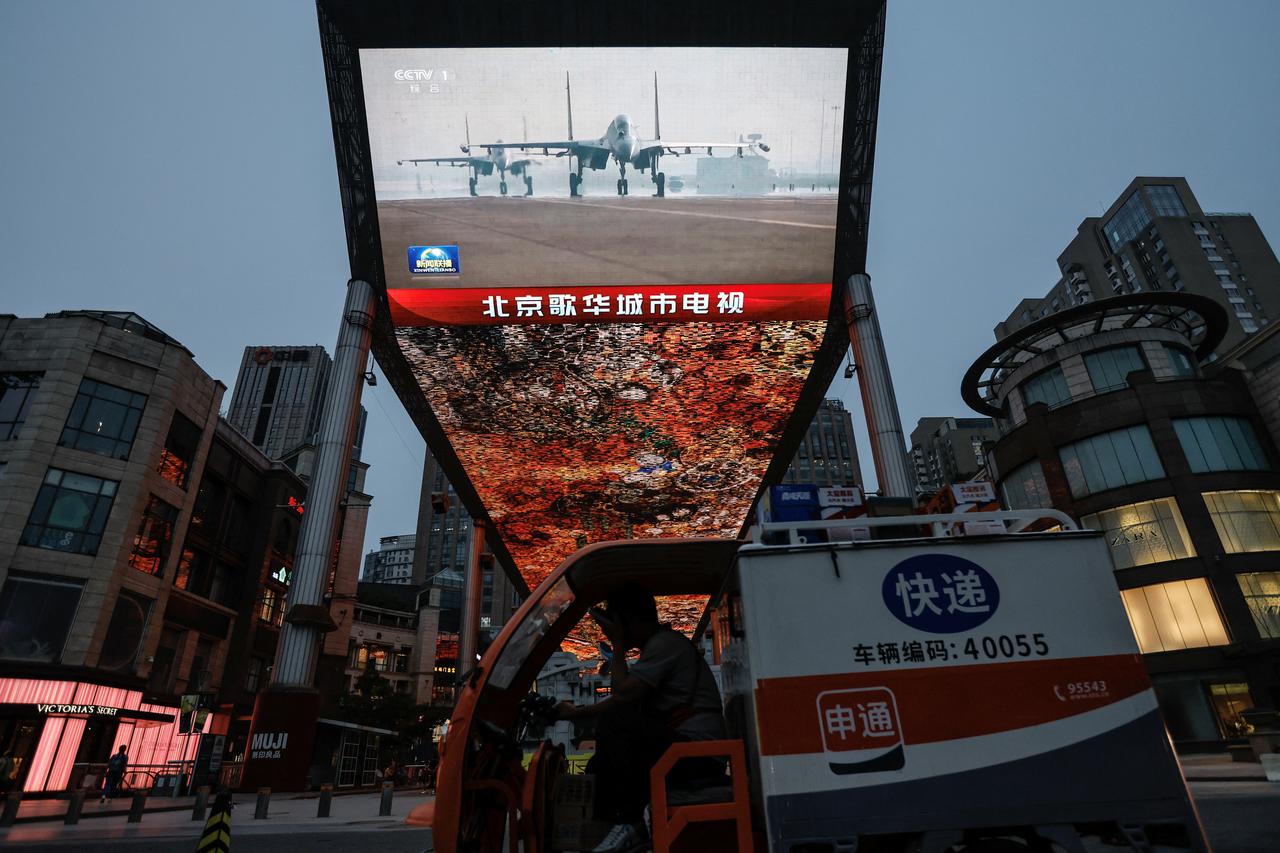 Screen shows news footage of military drills in areas around the island of Taiwan conducted by the Eastern Theatre Command of the Chinese People's Liberation Army (PLA), in Beijing