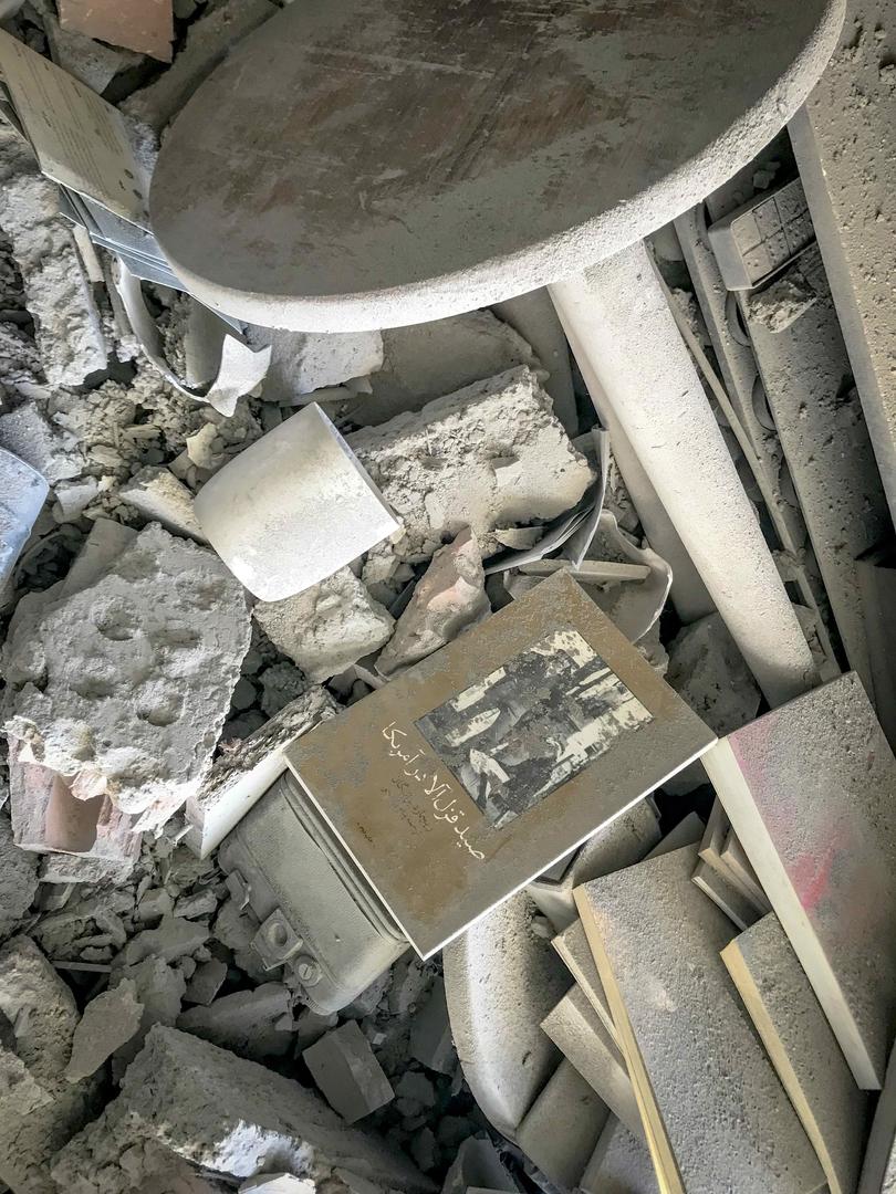 Photo from inside a house across a targeted residential building shows extensive damage in Tehran, Iran, on June 13, 2025. The book's title reads "the Burnt Earth". Photo by Saba/Middle East Images/ABACAPRESS.COM Photo: Middle East Images/ABACA/ABACA