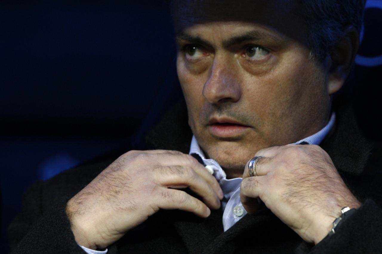 'Real Madrid\'s Portuguese coach Jose Mourinho looks on before the Spanish league football match Real Madrid CF vs Atletico Madrid at the Santiago Bernabeu stadium in Madrid on December 1, 2012.   AFP