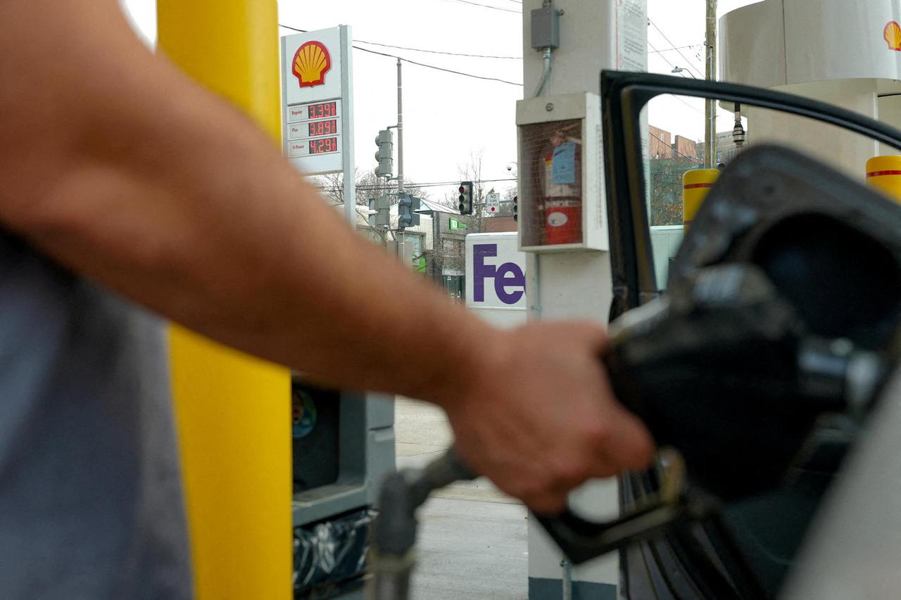 FILE PHOTO: Gas prices are seen at a fueling station, as the price of oil and gas has surged amid the U.S.-Israeli conflict with Iran, in Washington
