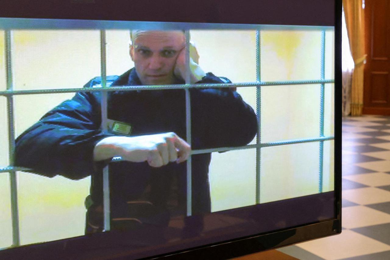 FILE PHOTO: Jailed Russian opposition leader Alexei Navalny is seen on a screen during a court hearing in Moscow