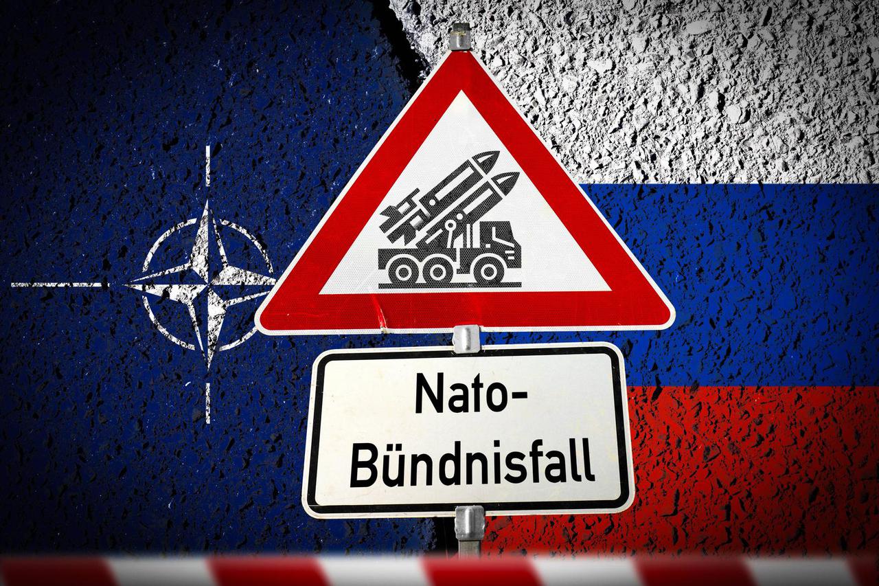Germany - September 10, 2025: PHOTOMONTAGE, sign with rocket launcher symbol and the lettering: NATO alliance case, in f