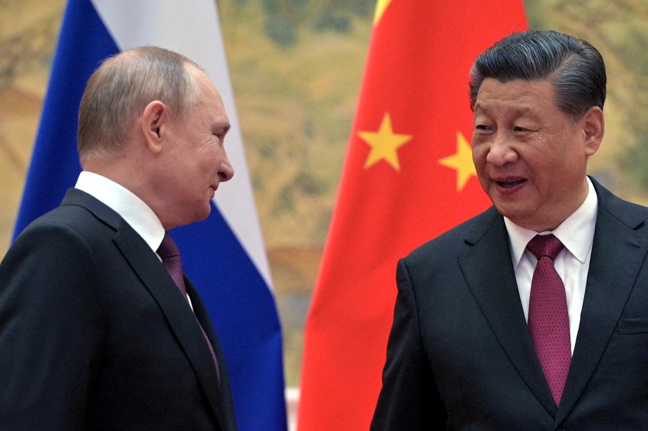 FILE PHOTO: Russian President Putin meets Chinese President Xi in Beijing