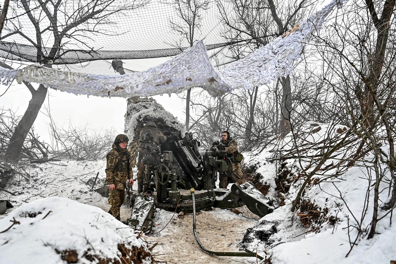 Member of the National police special demining unit blow up ant-tank mines during a demining operation near Izum