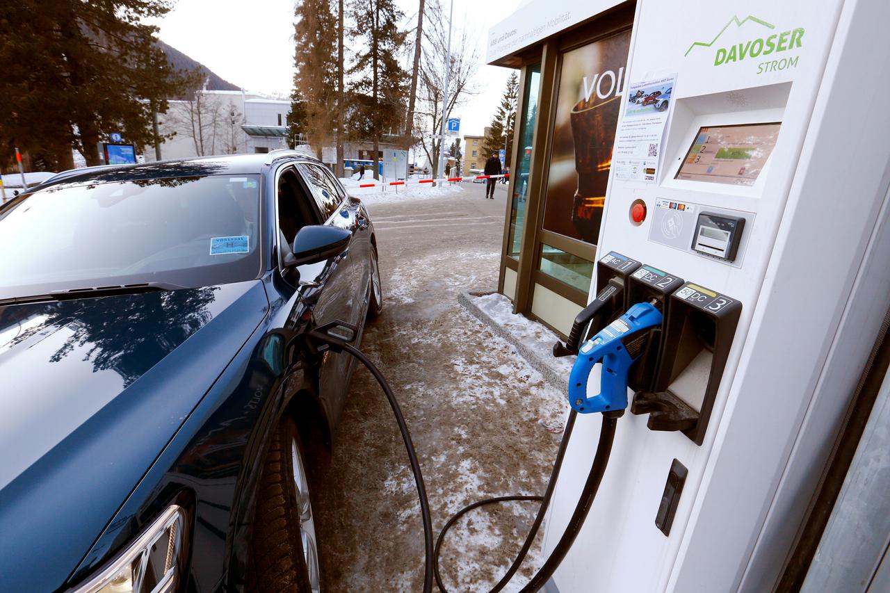 FILE PHOTO: An electric-powered Audi car is charged at a charging station in Davos