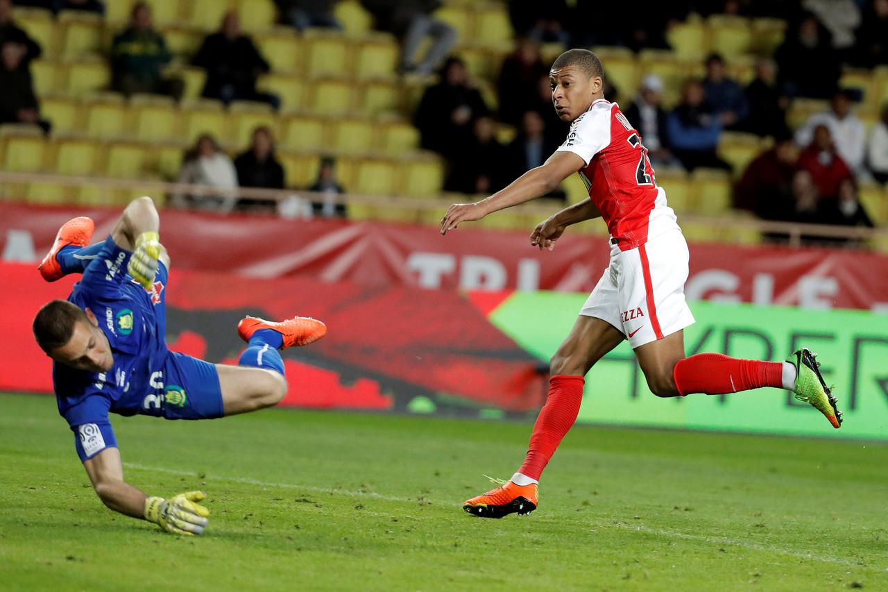 Football Soccer - Monaco v Nantes - French Ligue 1 - Louis II Stadium, Monaco - 5/03/2017 - Monaco's Kylian Mbappe scores against Nantes' goalkeeper Maxime Dupe.  REUTERS/Eric Gaillard