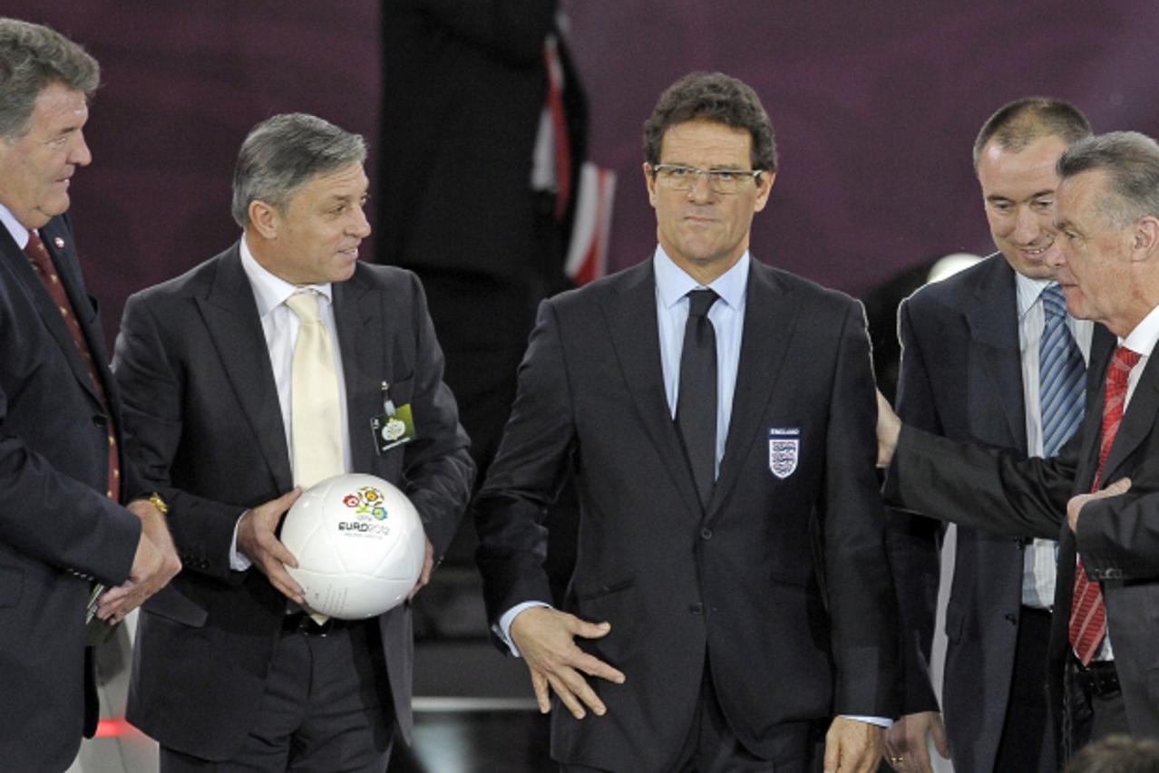 'Coaches of group G (from L) Wales John Toshack, Montenegro Zlatko Kranjcar (holding an official Euro 2012 ball), England Fabio Capello, Bulgaria Stanimir Stoilov and Swizerland Ottmar Hitzfel stand o