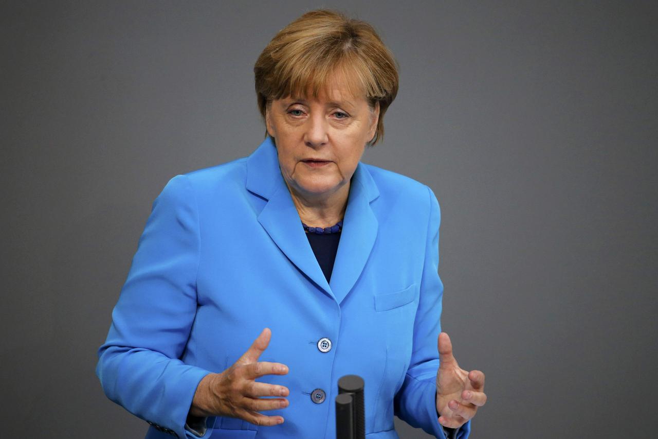 German Chancellor Angela Merkel gestures as she addresses the lower house of parliament Bundestag on Germany's 2016 budget in Berlin, Germany September 9, 2015. REUTERS/Fabrizio Bensch