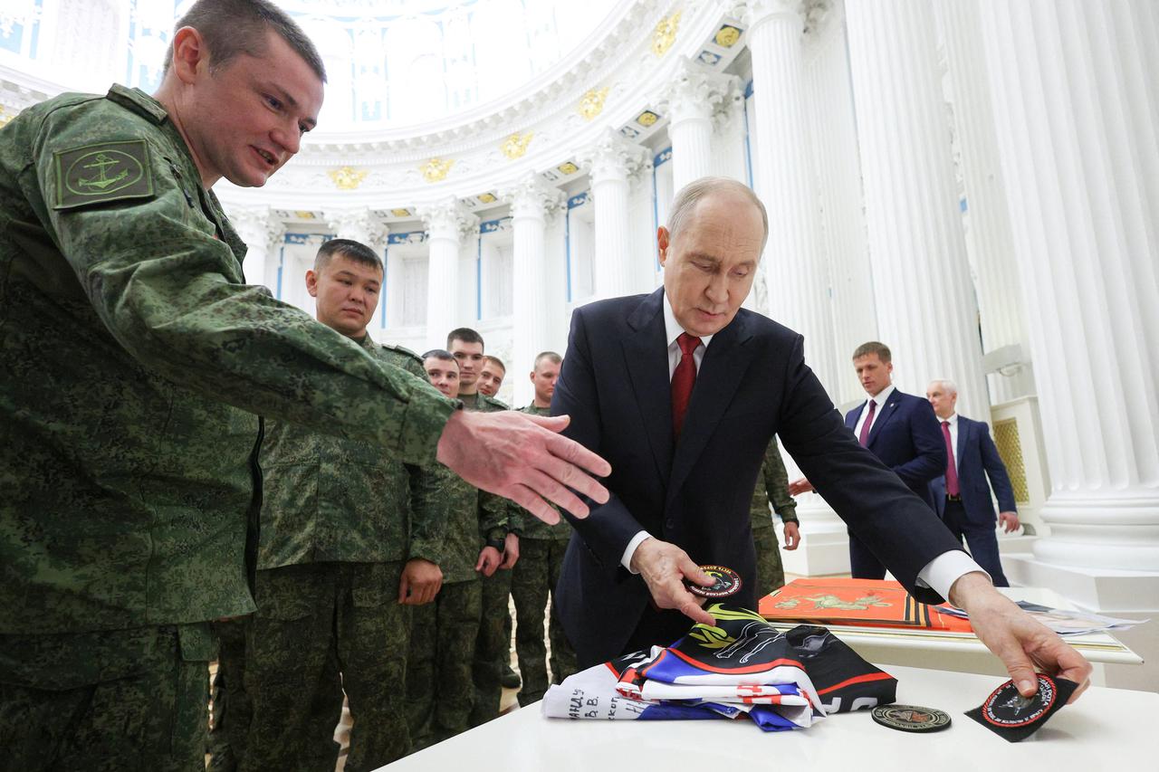 Russia's President Putin meets with service members in Moscow