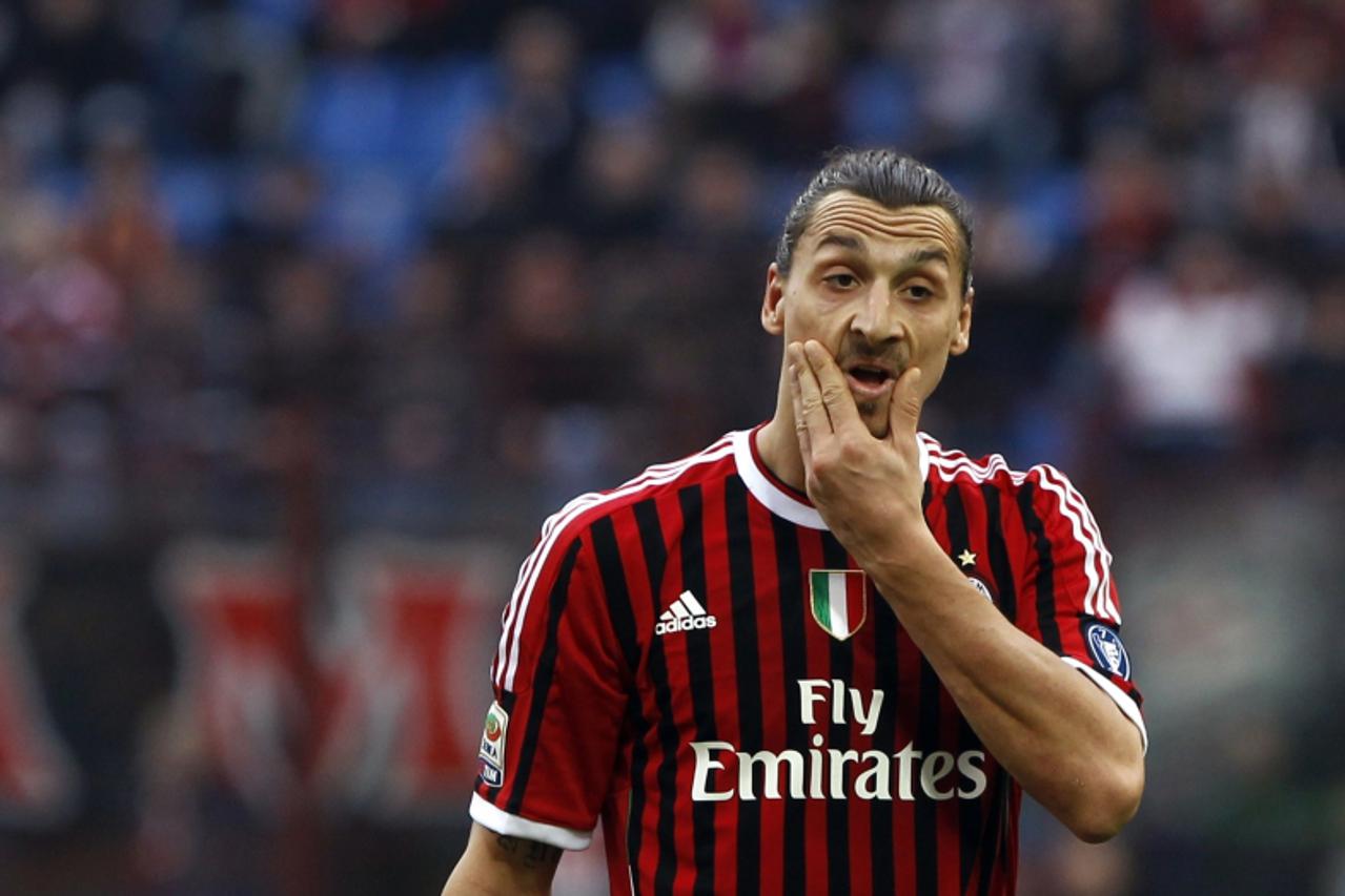 'AC Milan\'s Zlatan Ibrahimovic reacts during their Italian Serie A soccer match against Lecce at the San Siro stadium in Milan March 11, 2012. REUTERS/Alessandro Bianchi (ITALY - Tags: SPORT SOCCER)'