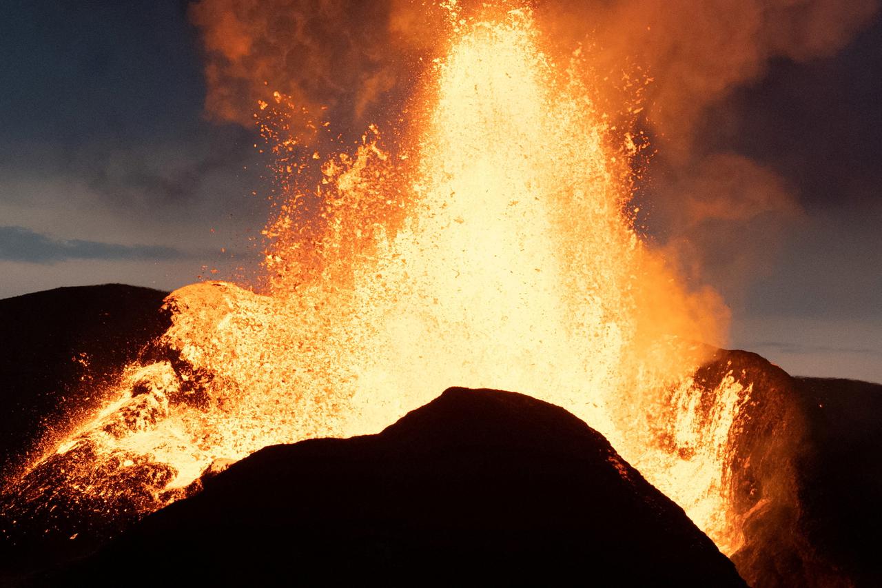 FILE PHOTO: Lava erupts from the Fagradalsfjall volcano in 2021