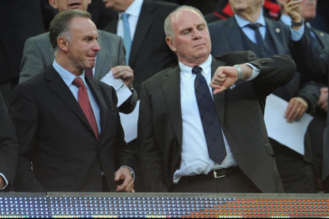 'Munich\'s president Uli Hoeness (R) and Munich\'s Chief Executive Officer Karl-Heinz Rummenigge seen on the stands during the UEFA Champions League semi final second leg soccer match between FC Barce