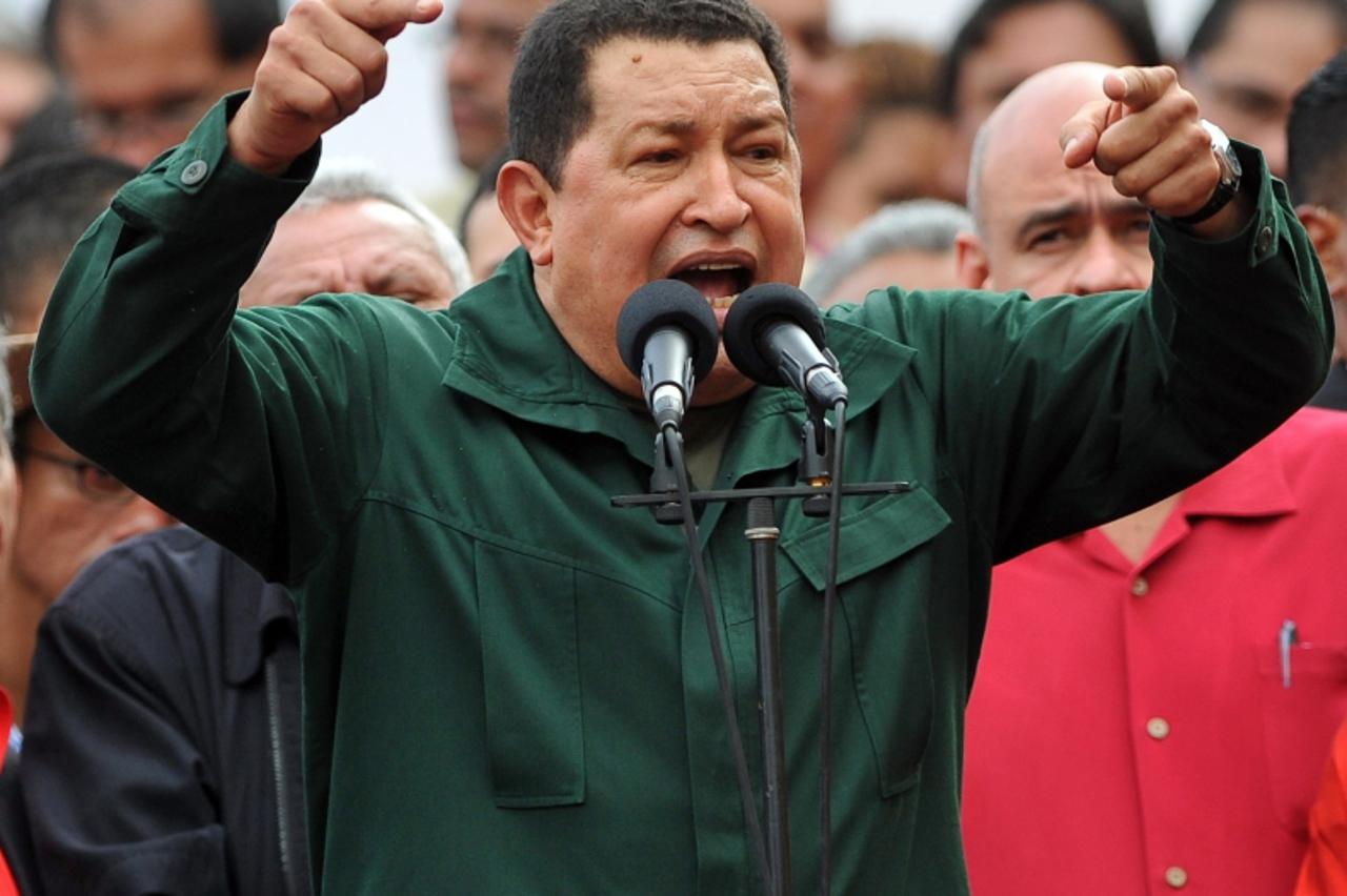 'Venezuelan President Hugo Chavez speaks during a ceremony presenting the new leadership of the National Assembly  in Caracas on January 5, 2011. A new National Assembly was seated Wednesday in Venezu