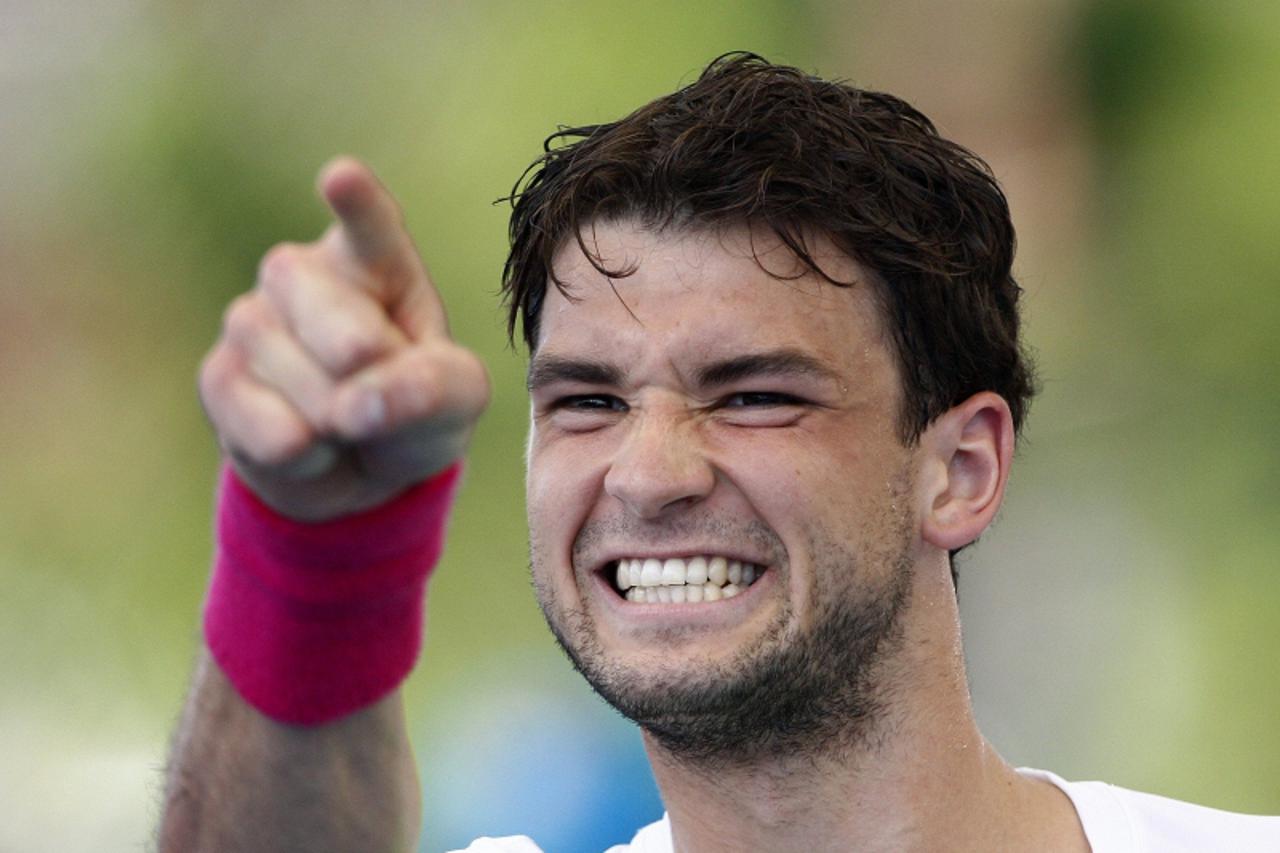 'Grigor Dimitrov of Bulgaria reacts after defeating Milos Raonic of Canada in their men's singles match at the Brisbane International tennis tournament January 3, 2013. REUTERS/Daniel Munoz (AUSTRALI