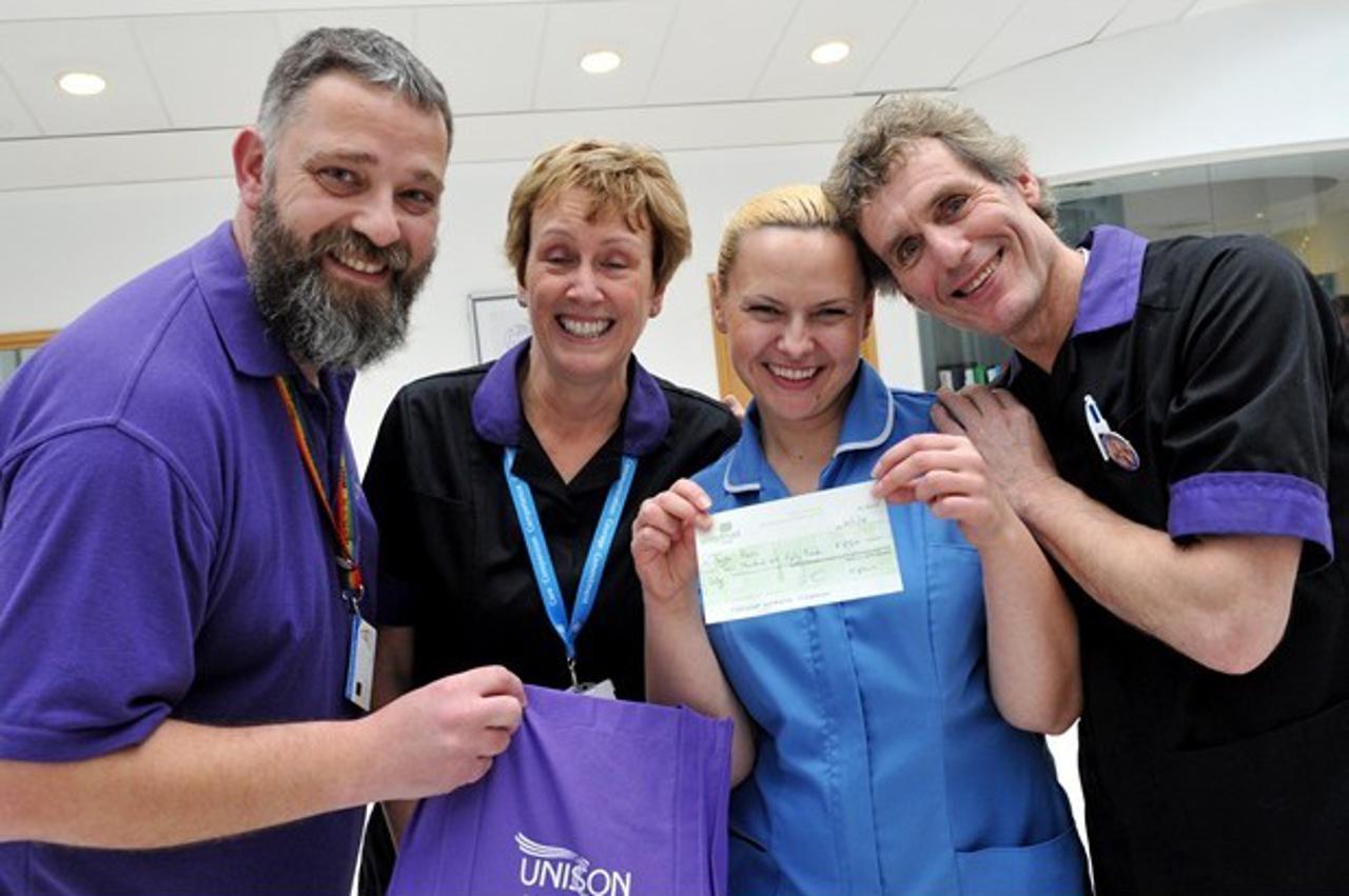 Pictured is thrilled Tanja Bajić accepting money from Royal Stoke University Hospital staff Stewart Robinson, Branch Sec for Unison, Anne Barks, Care Coach for Overseas Nurses and Paul Broad, Lead for Preceptorship    Brief: Workers at the Royal Stoke Uni