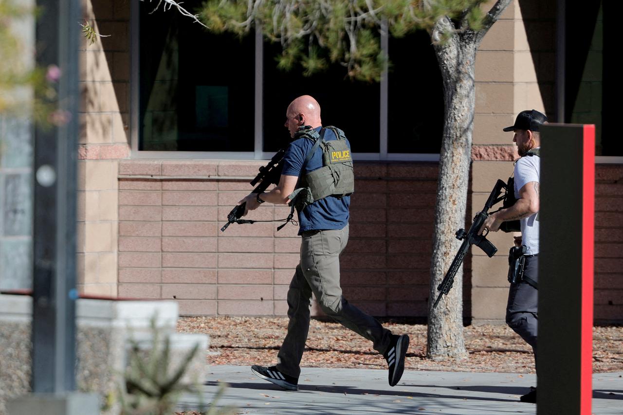 FILE PHOTO: Law enforcement officers head into UNLV campus after reports of an active shooter in Las Vegas