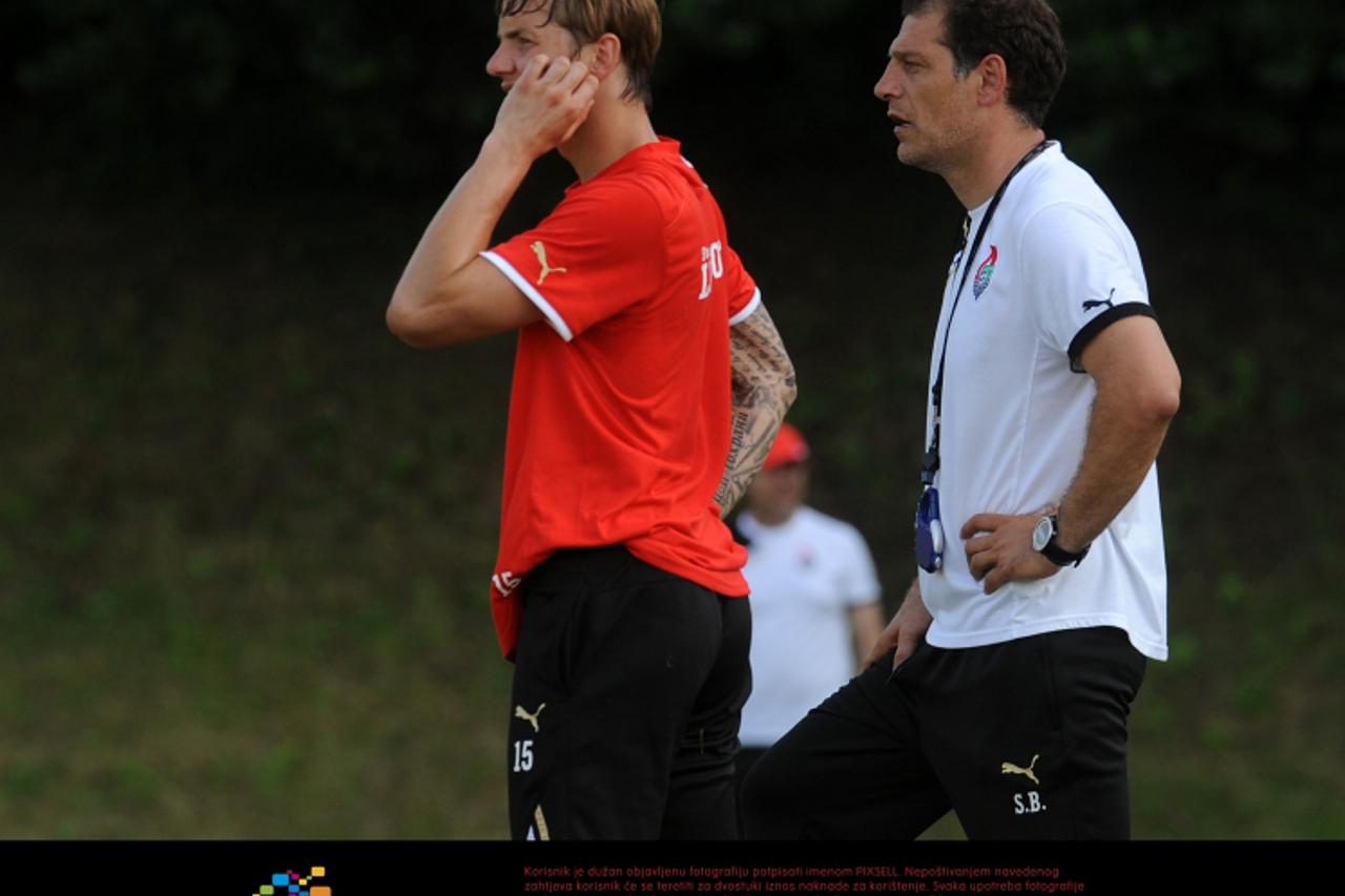 '02.07.2012., Pohorje - Popodnevni trening bivseg selektora hrvatske nogometne reprezentacije i novog trenera FC Lokomotiv Slavena Bilica. Roman Pavljucenko, Slaven Bilic.  Photo: Daniel Kasap/PIXSELL