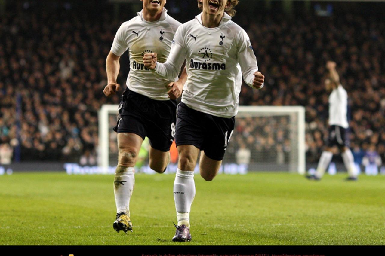 'Tottenham Hotspur\'s Luka Modric (right) celebrates scoring his sides\' second goal with team mate Scott Parker Photo: Press Association/Pixsell'