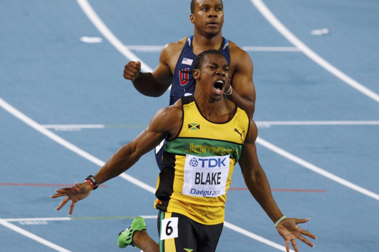 'Yohan Blake of Jamica (front) celebrates in front of Walter Dix of the U.S. after winning the men\'s 100 metres final at the IAAF World Athletics Championships in Daegu August 28, 2011. Dix finished 
