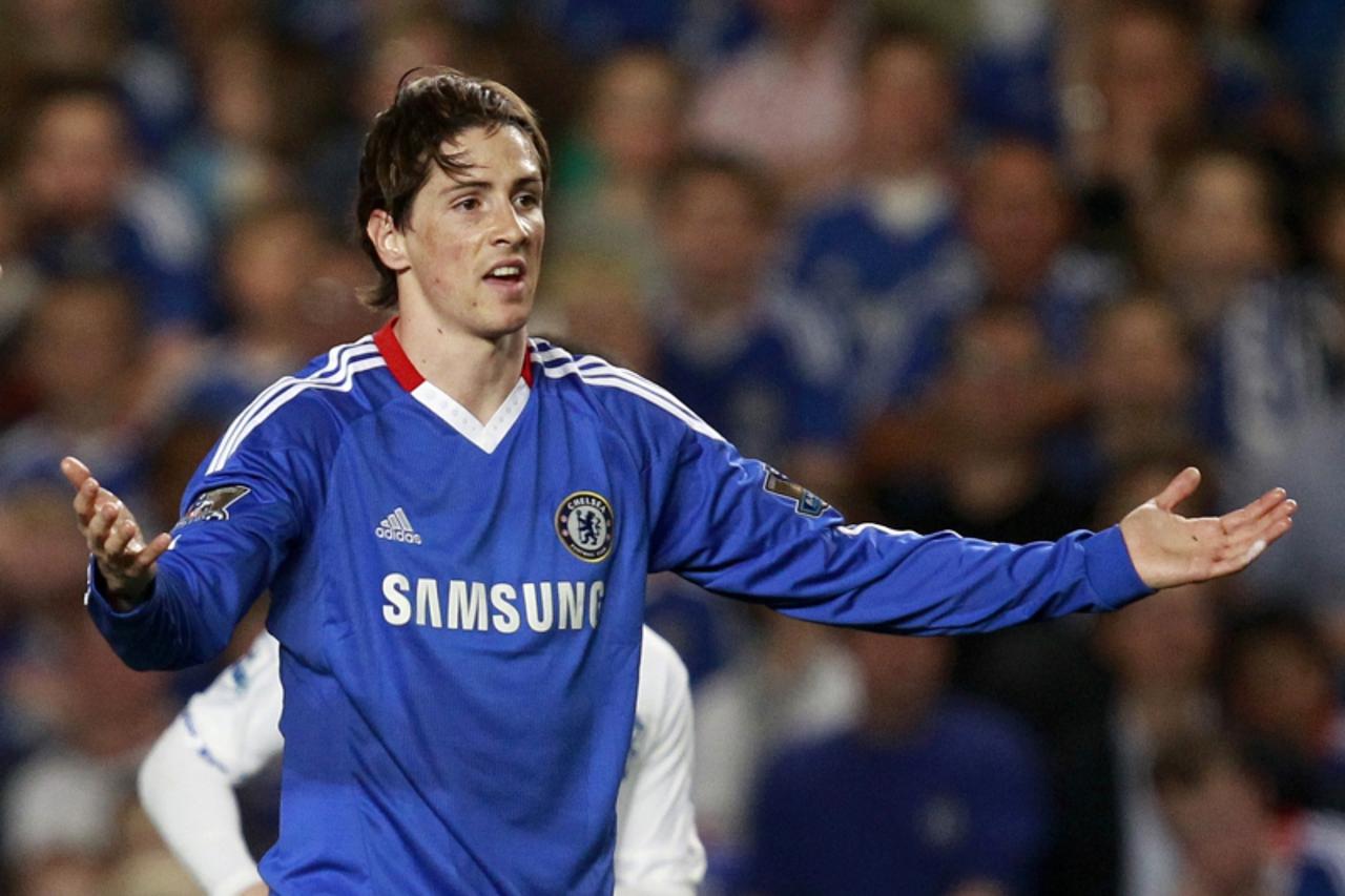 'Chelsea\'s Fernando Torres gestures during their English Premier League soccer match against Birmingham City at Stamford Bridge in London, April 20, 2011.   REUTERS/Eddie Keogh   (BRITAIN - Tags: SPO