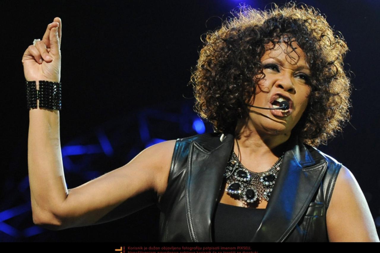 'US singer Whitney Houston stands on stage at o2-Arena in Berlin, Germany, 12 May 2010. This concert is the first of the alltogether ten performances in Germany on the occaision of her comeback tour t