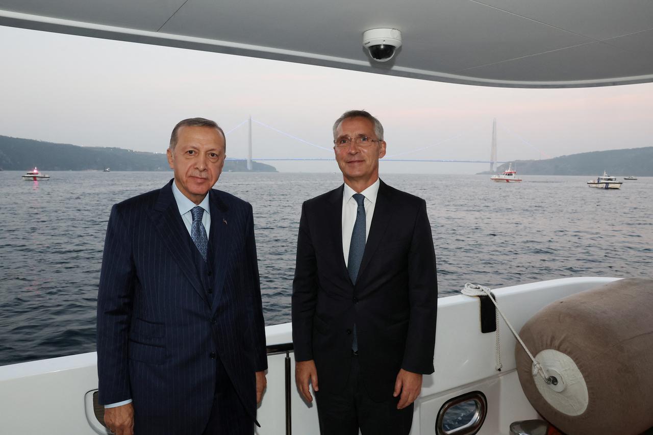 Turkish President Tayyip Erdogan and NATO Secretary-General Jens Stoltenberg pose as they sail through Bosphorus in Istanbul