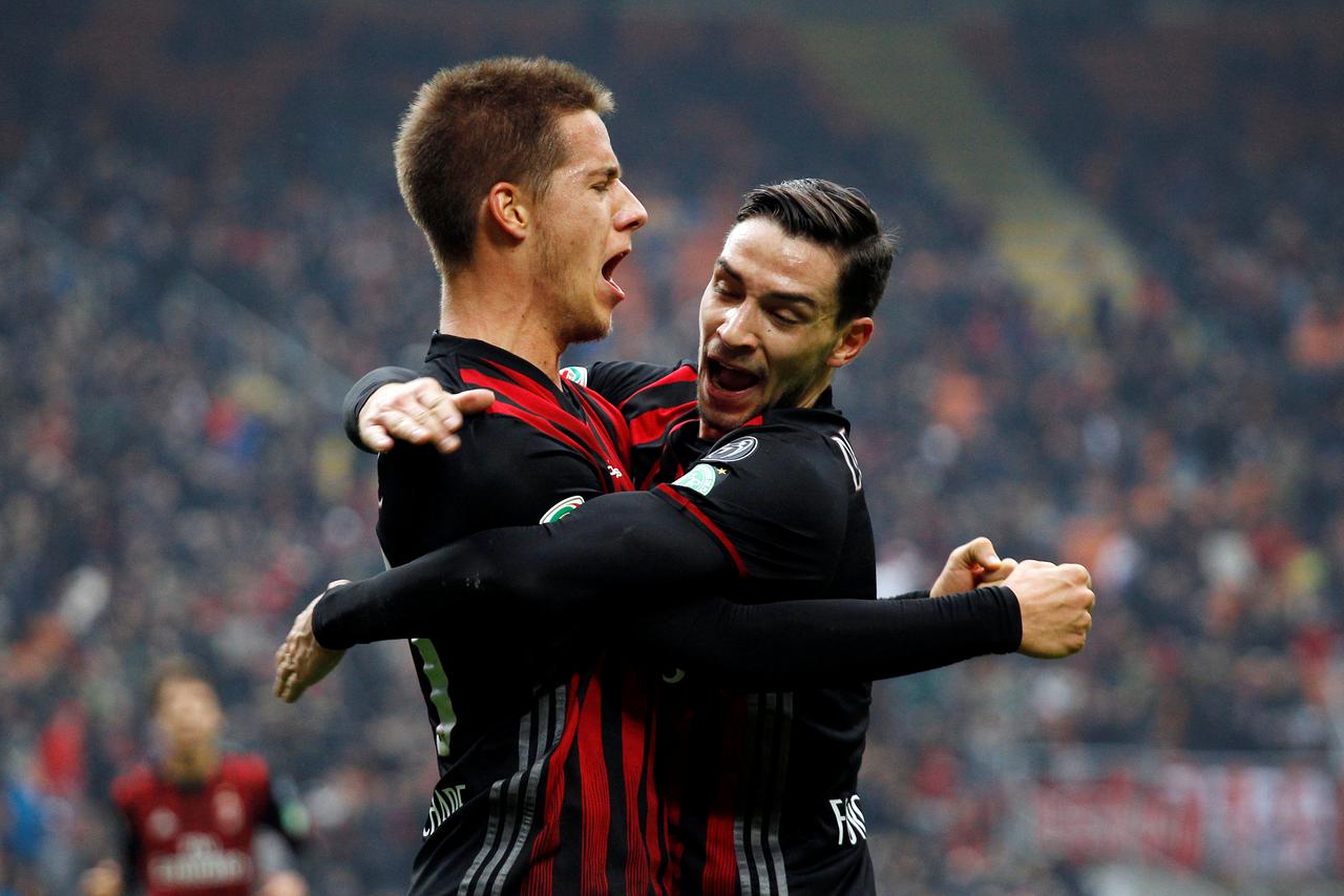 Football Soccer - AC Milan v Crotone - Italian Serie A - San Siro stadium, Milan, Italy - 4/12/16 - AC Milan's Mario Pasalic celebrates with his team mate Mattia De Sciglio after scoring. REUTERS/Alessandro Garofalo