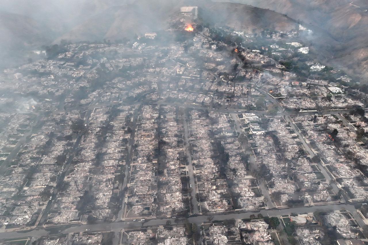 Palisades fire burns during a windstorm on the west side of Los Angeles