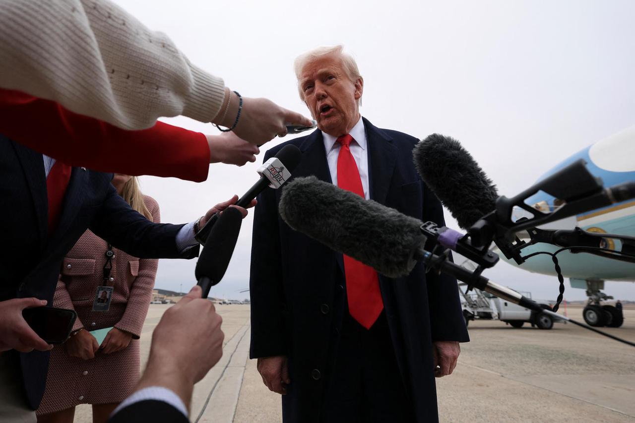 Trump speaks before boarding Air Force One as he departs for Florida