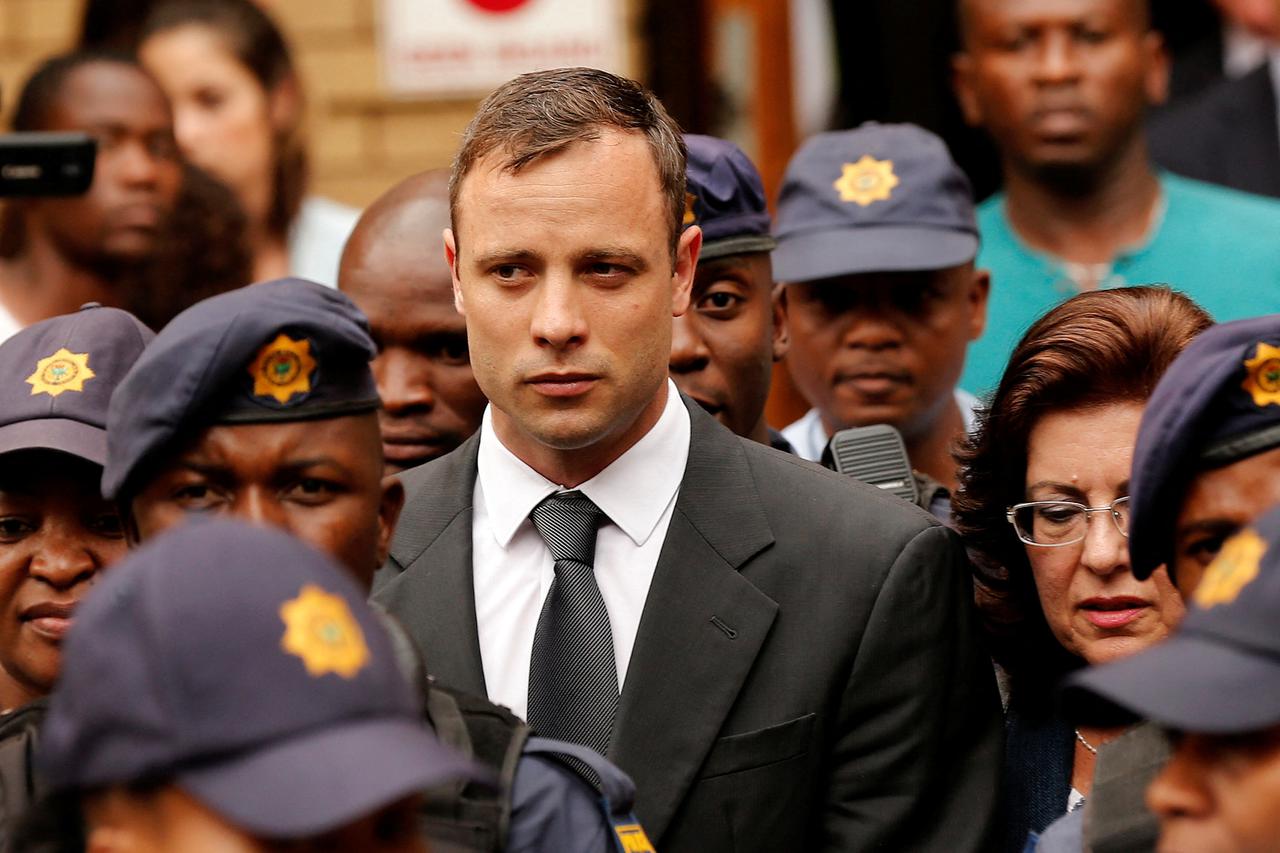 FILE PHOTO: South African Olympic and Paralympic sprinter Oscar Pistorius leaves the North Gauteng High Court in Pretoria