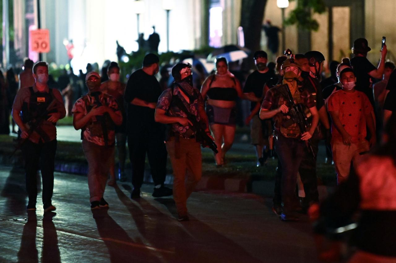 People protest after a Black man identified as Jacob Blake was shot several times by police in Kenosha