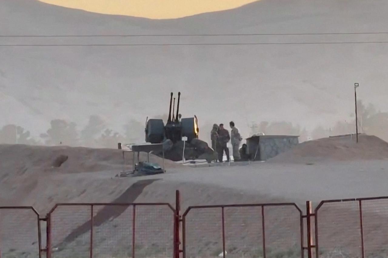 Military personnel stand guard at Iran's Isfahan nuclear facility