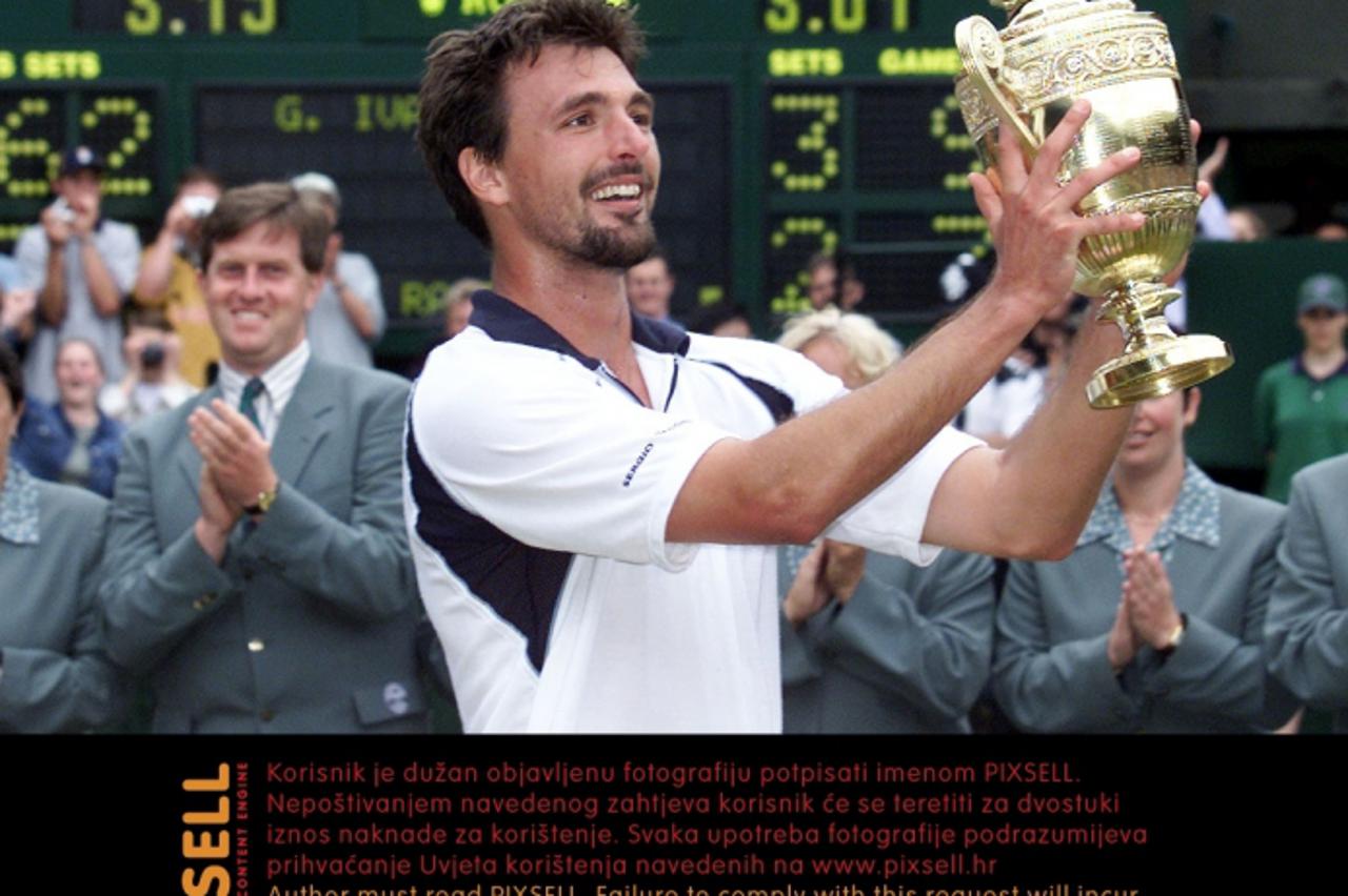 \'Wimbledon Ivanisevic wins title NO COMMERCIAL USE:  Goran Ivanisevic of Croatia celebrates with the trophy after beating Australia\'s Pat Rafter during the Mens Final of the 2001 Lawn Tennis Champio
