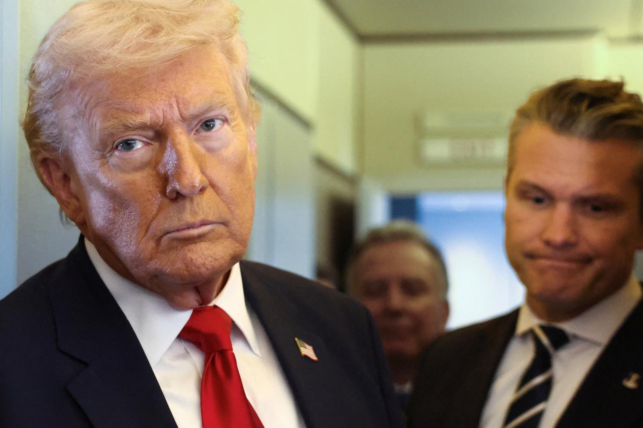 Trump speaks to reporters aboard Air Force One