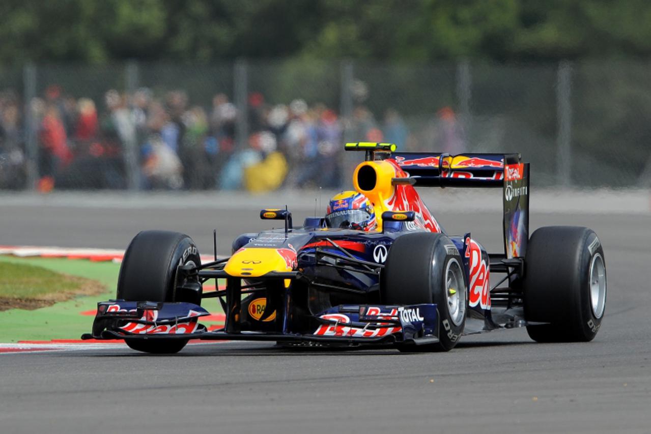 'Red Bull Racing\'s Australian driver Mark Webber drives at the Silverstone circuit on July 9, 2011 during the third practice session of the of the Formula One Grand Prix.   AFP PHOTO / ANDREW YATES'