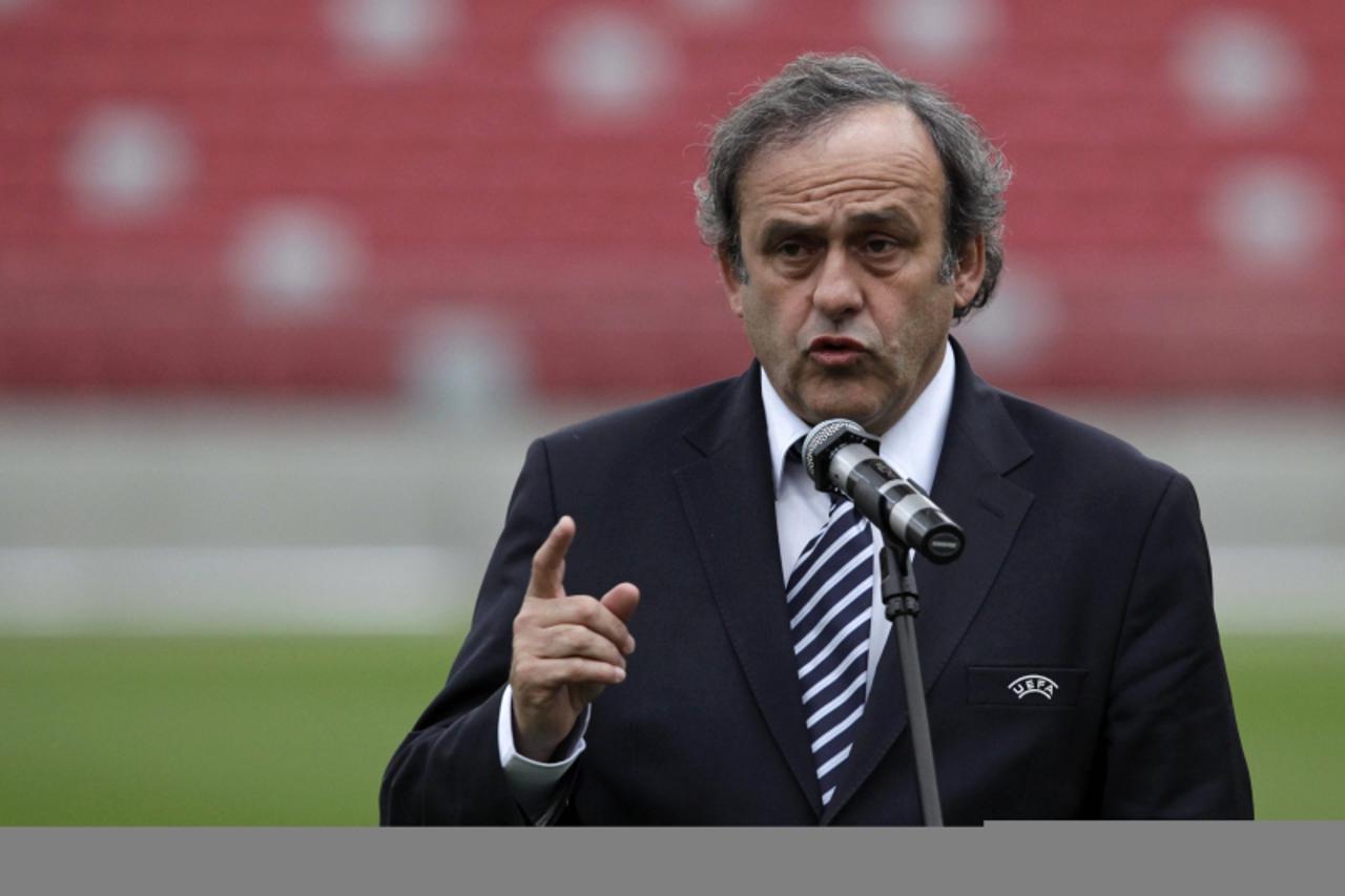 'UEFA President Michel Platini speaks during a news conference about preparations for the EURO 2012 soccer championships at the National Stadium in Warsaw April 12, 2012. REUTERS/Kacper Pempel (POLAND