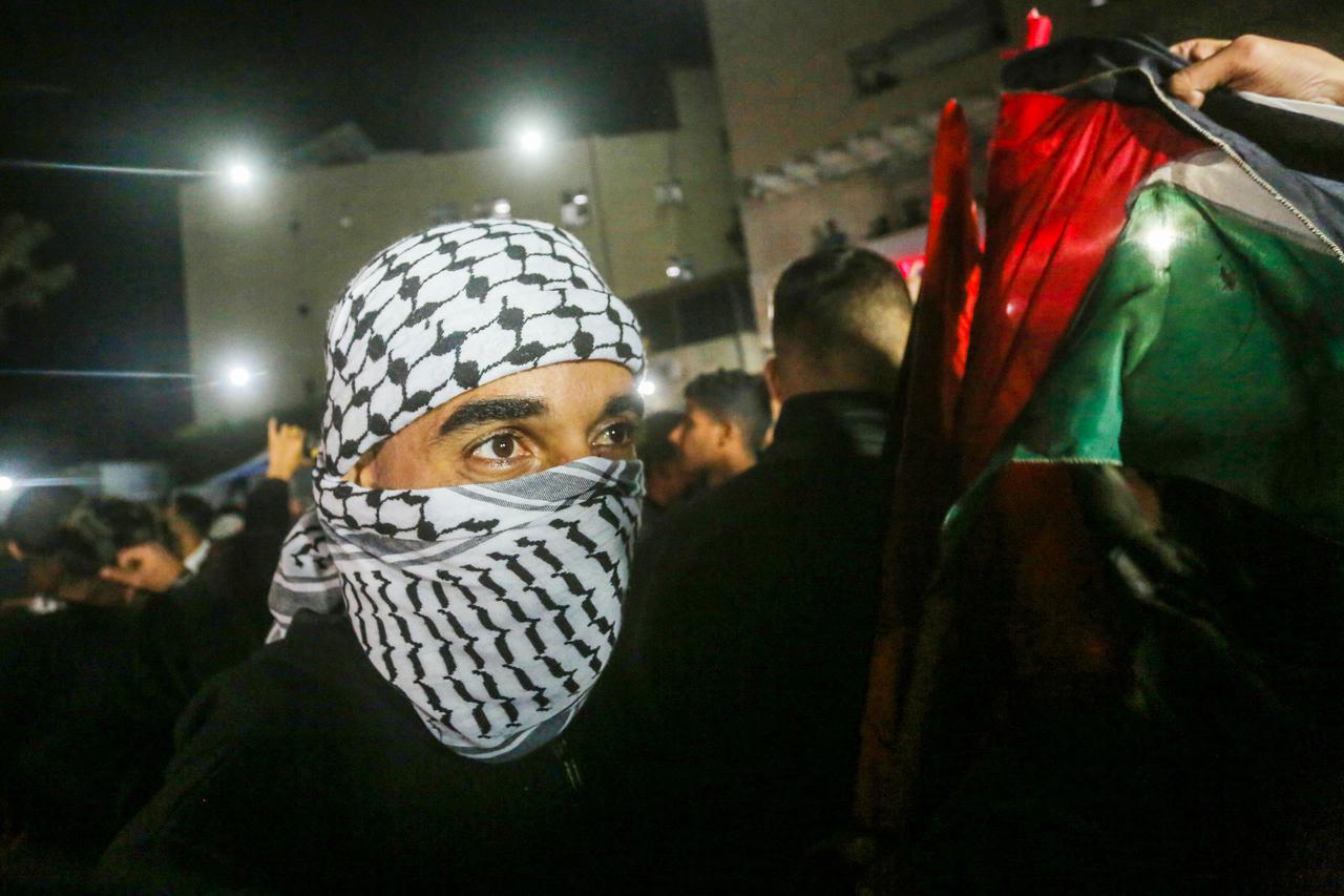 Palestinians react to news on a ceasefire deal with Israel, in Khan Younis in the southern Gaza Strip