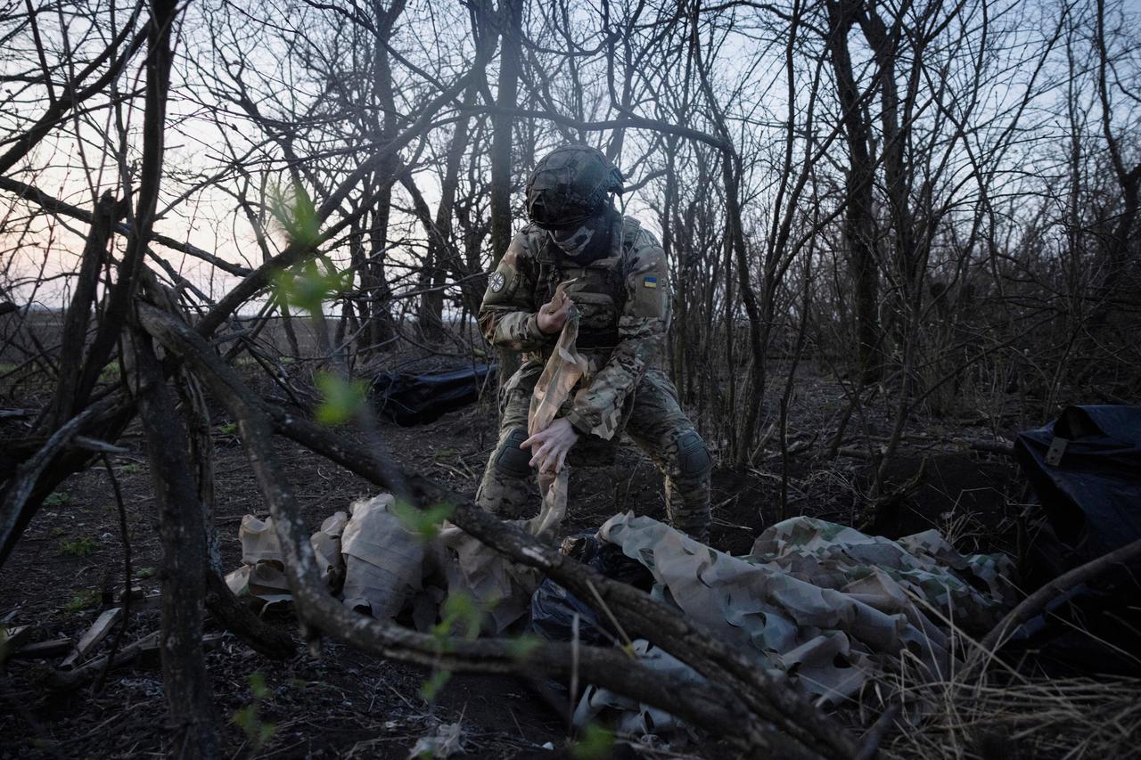 A member of a drone unit of Ukraine’s 58th Motorized Brigade unpacks equipment near the front line in the Donetsk region