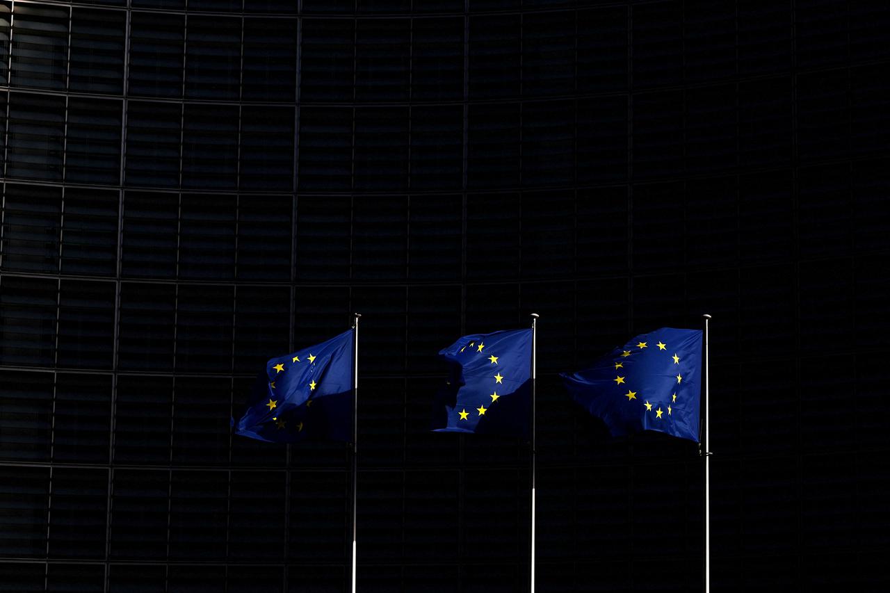 FILE PHOTO: European Union flags flutter outside the European Commission headquarters, in Brussels