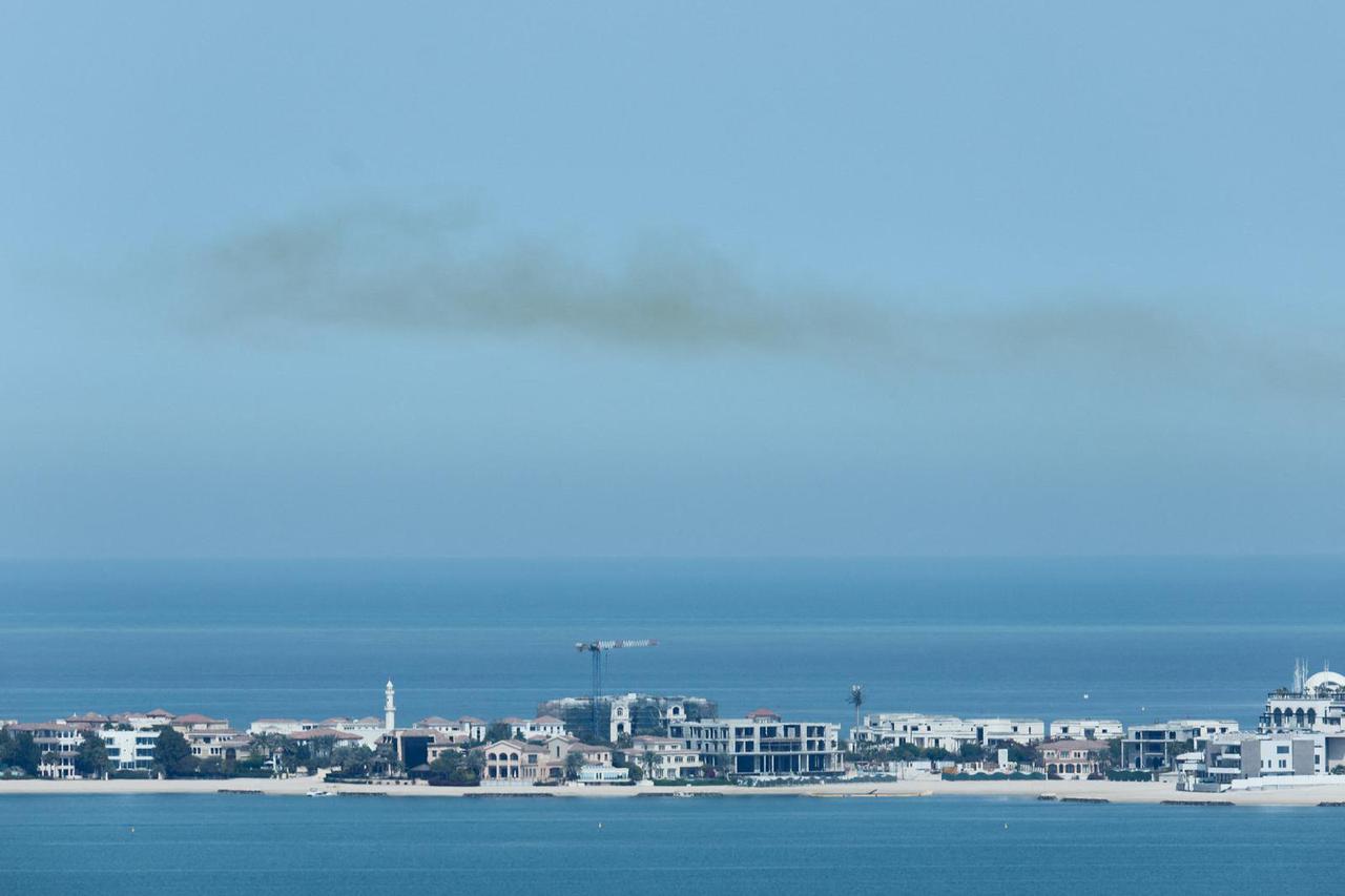 Smoke is left in the sky after blasts were heard in Doha