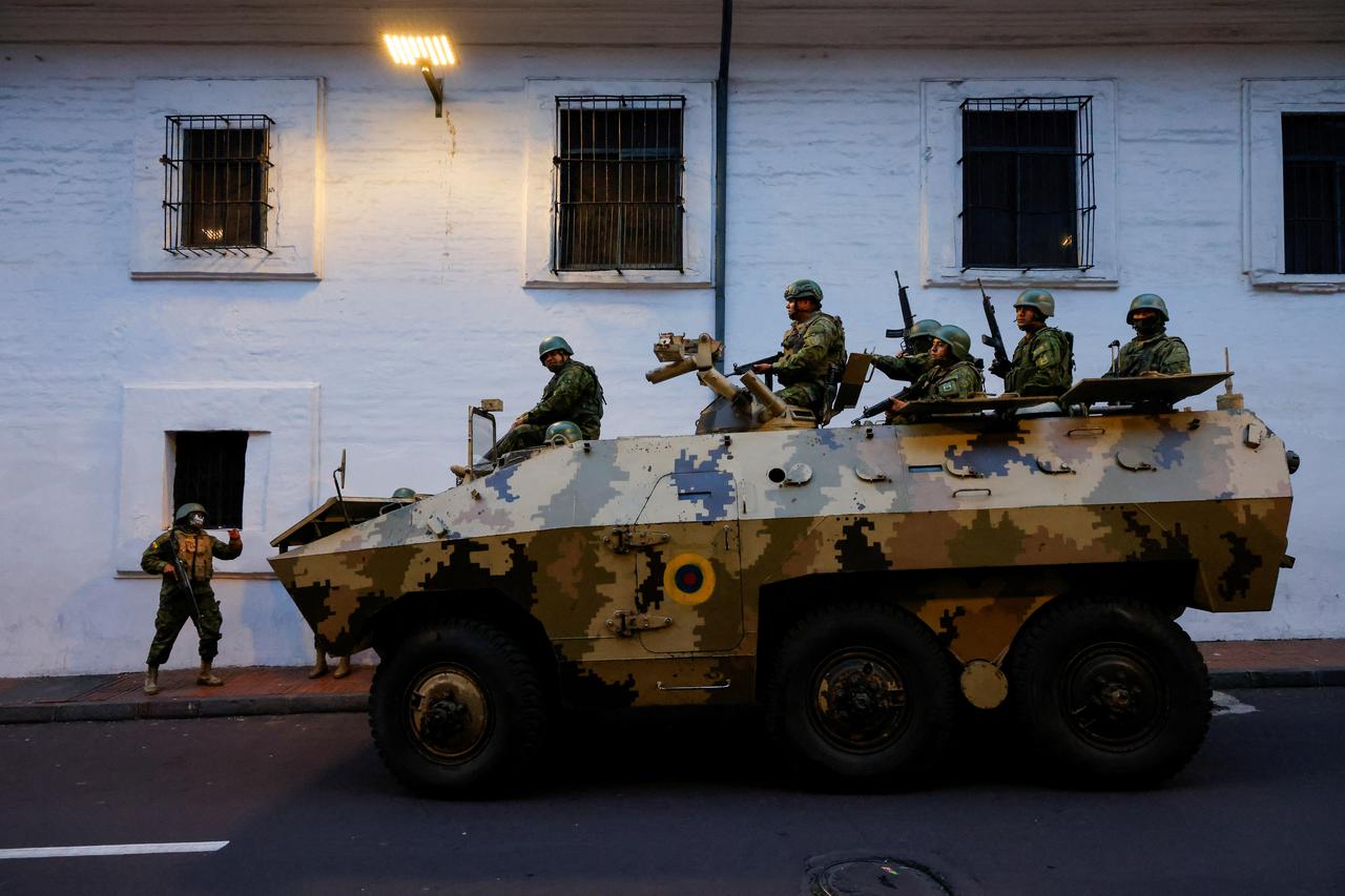 Security forces patrol after a violence outbreak, in Quito
