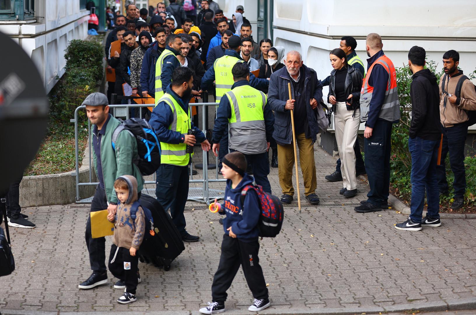 Migrants queue in a waiting area to be escorted to a registration office at the arrival centre for asylum seekers in Reinickendorf district, Berlin, Germany, October 6, 2023. REUTERS/Fabrizio Bensch Photo: Fabrizio Bensch/REUTERS