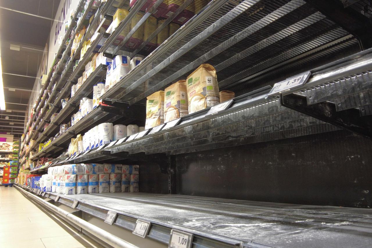 An almost empty supermarket shelf in Bonn