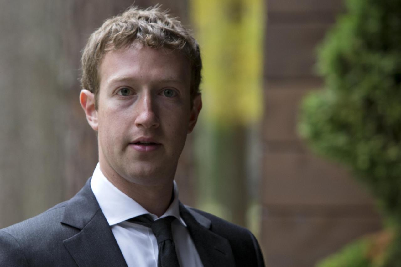'Facebook CEO Mark Zuckerberg looks on before a meeting with Russian Prime Minister Dmitry Medvedev at the Gorki residence outside Moscow, October 1, 2012.  REUTERS/Alexander Zemlianichenko/Pool (RUSS
