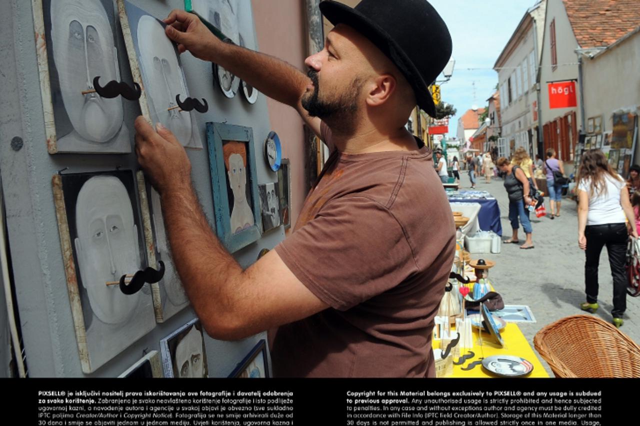 '29.08.2012., Centar grada, Varazdin, Sesti dan 14. Spancirfesta. Uska ulica pretvorena je u Paletafest gdje su smjesteni umjetnici  Photo: Marko Jurinec/PIXSELL'